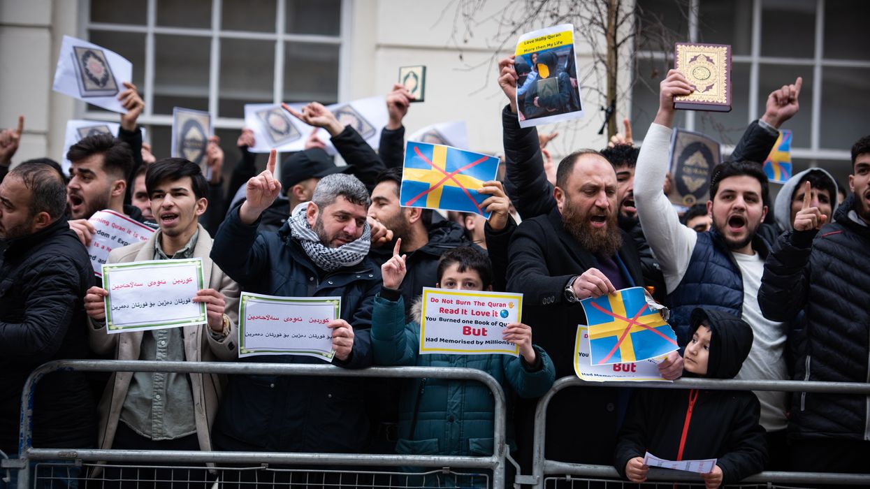 Protestors chant slogans during the demonstration against the Quran Burning In Sweden.