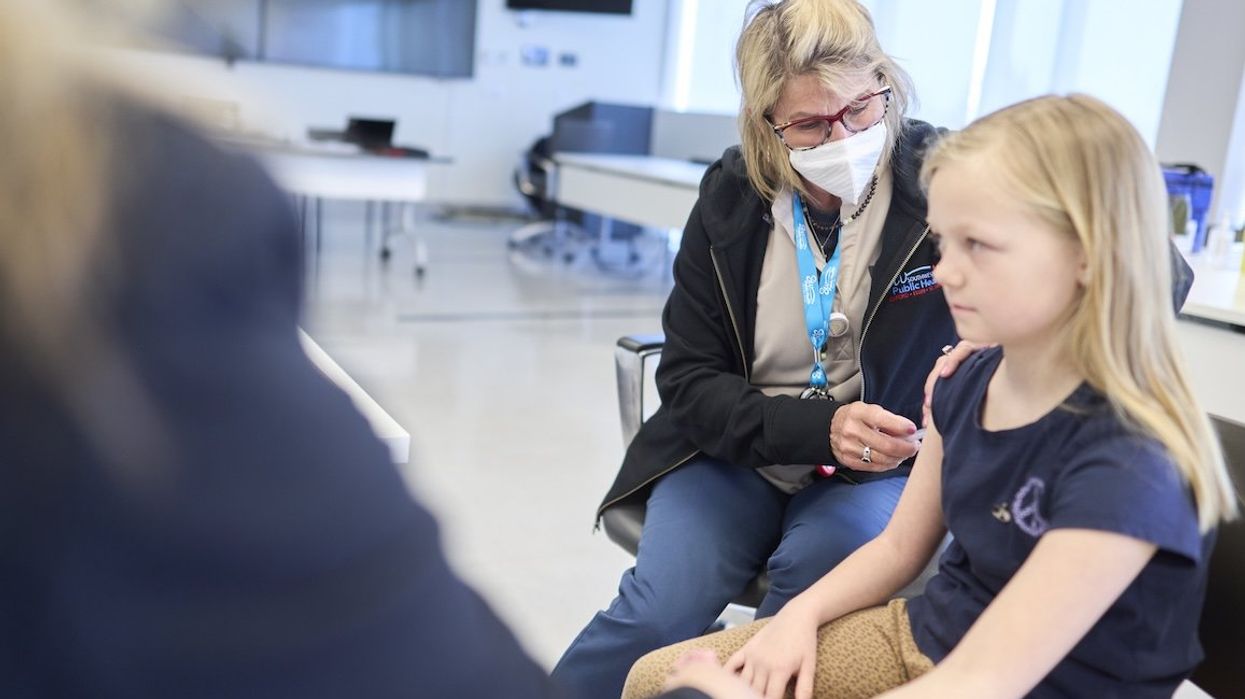 Public Health nurse Lauri Bidinot demonstrates how to give a measles shot to a young girl at Southwestern Public Health in St. Thomas, Ontario, on Tuesday, March 4, 2025.