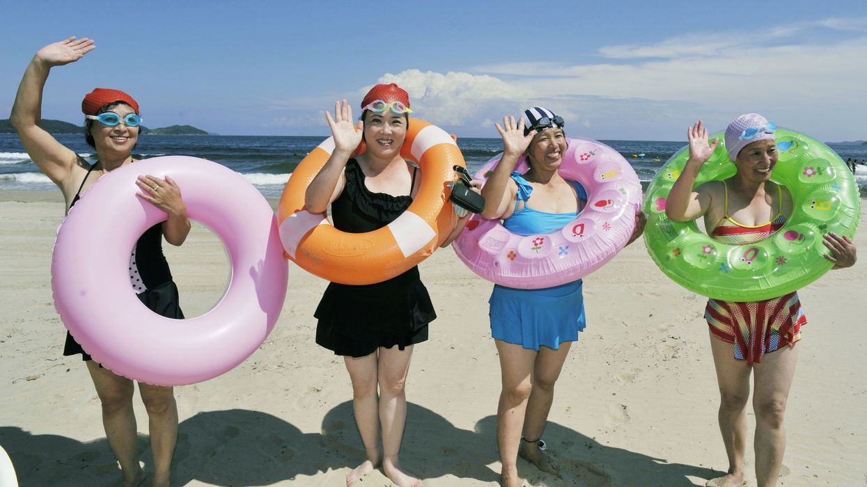PYONGYANG, North Korea - A group of women visit a beach resort in Wonsan, North Korea, in September 2013. The women said they are coworkers at a clothes factory in the capital Pyongyang and their trip to Wonsan is a reward for an increase in output.