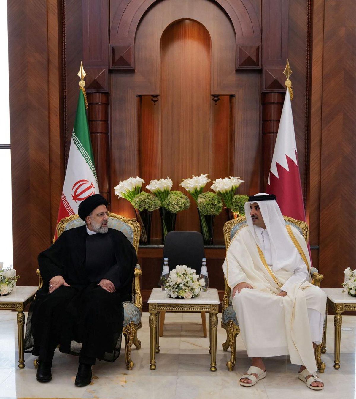 Qatar's Emir Sheikh Tamim bin Hamad Al-Thani meets with Iran's President Ebrahim Raisi, in Doha. 