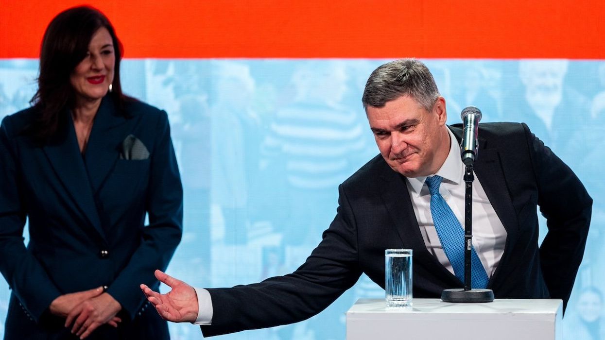 Re-elected Croatian President Zoran Milanovic with wife Sanja Music Milanovic celebrate after winning Croatia's presidential election ON January 12, 2025 in Zagreb, Croatia.