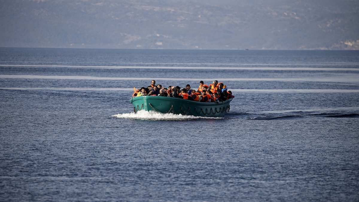 Refugees and migrants arrive on an overcrowded boat on the Greek island of Lesbos, November 10, 2015. Since the start of the year, over 590,000 people have crossed into Greece, the frontline of a massive westward population shift from war-ravaged Syria and beyond.