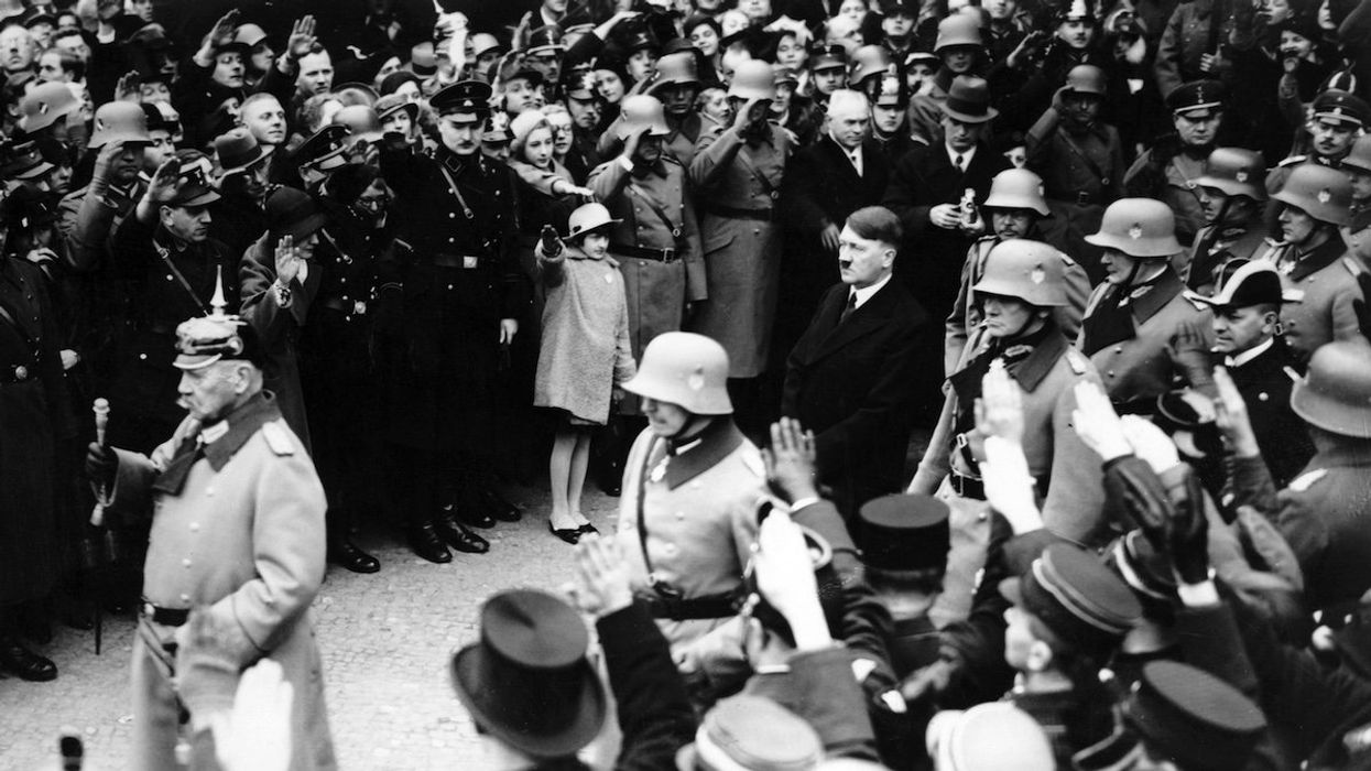 Reich President Paul von Hindenburg and Reich Chancellor Adolf Hitler are greeted by the people with the Nazi salute on the occasion of the Day of Commemoration of Heroes on 25 February 1934.