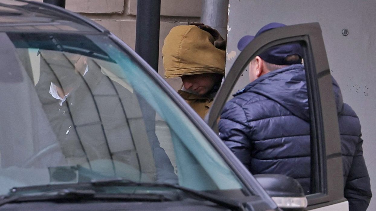 Reporter for U.S. newspaper The Wall Street Journal Evan Gershkovich, detained on suspicion of espionage, leaves a court building in Moscow, Russia March 30, 2023.