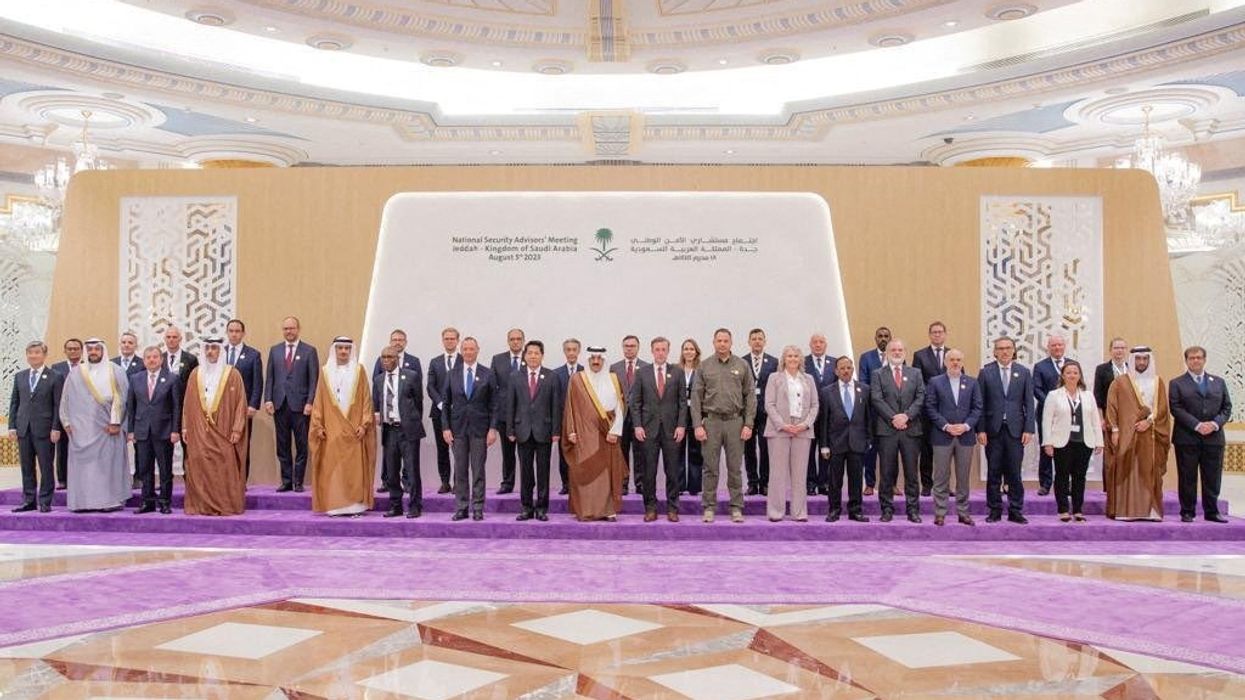 Representatives from more than 40 countries, including China, India, and the U.S., pose for a group picture as they attend talks in Jeddah, Saudi Arabia.