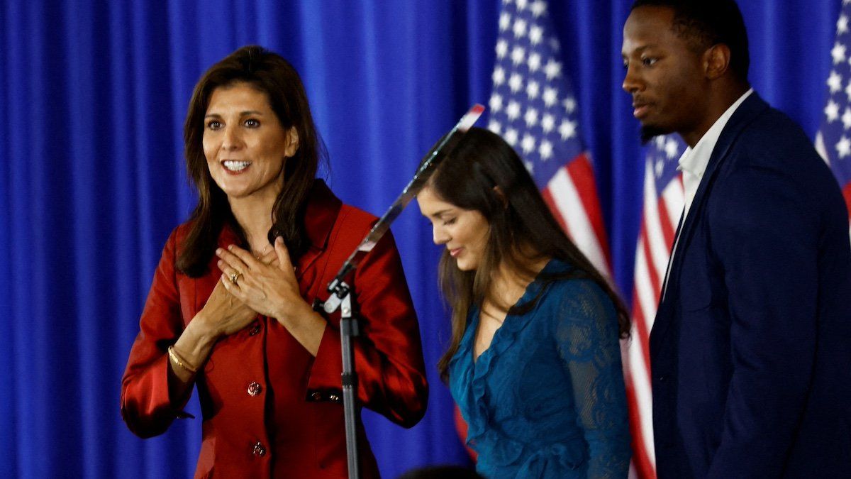 ​Republican presidential candidate and former U.S. Ambassador to the United Nations Nikki Haley reacts as her daughter Rena and Rena's husband Joshua stand next to her, at her watch party during the South Carolina Republican presidential primary election in Charleston, South Carolina, U.S. February 24, 2024. 