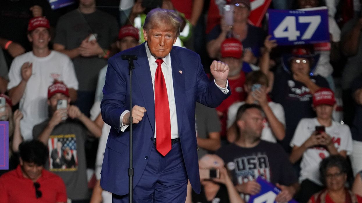 Republican presidential nominee and former U.S. President Donald Trump dances during a rally at Mullett Arena in Tempe, Arizona, U.S. October 24, 2024.