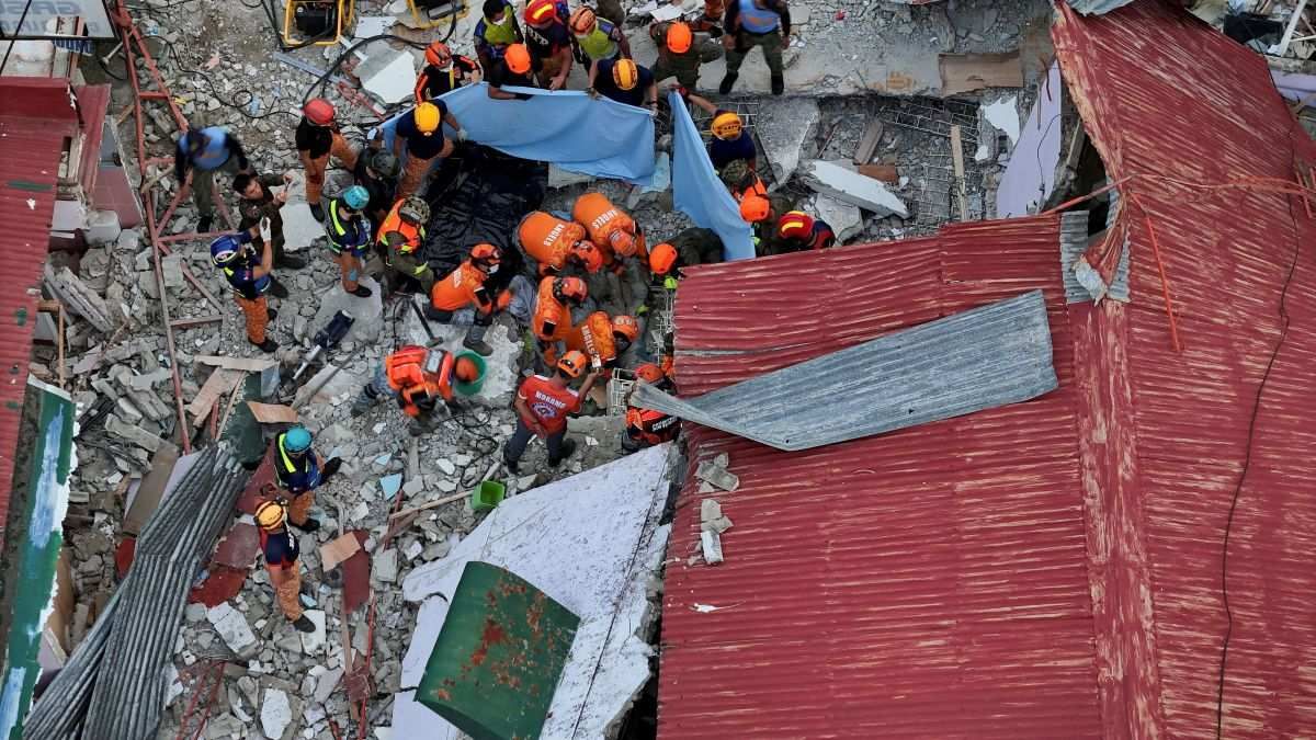 Rescue workers conduct a rescue operation following the 6.9-magnitude quake in Bogo, Cebu, Philippines, on October 1, 2025.