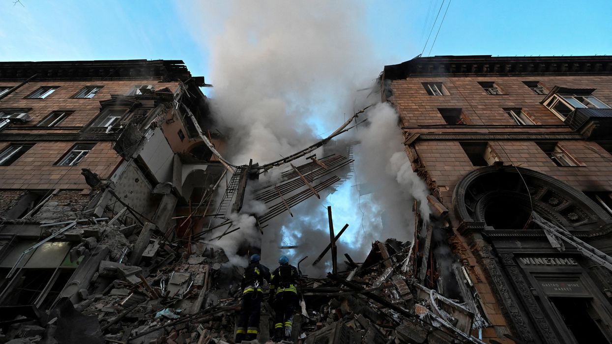 Rescuers work at a residential building heavily damaged by a Russian missile strike in Zaporizhzhia, Ukraine.