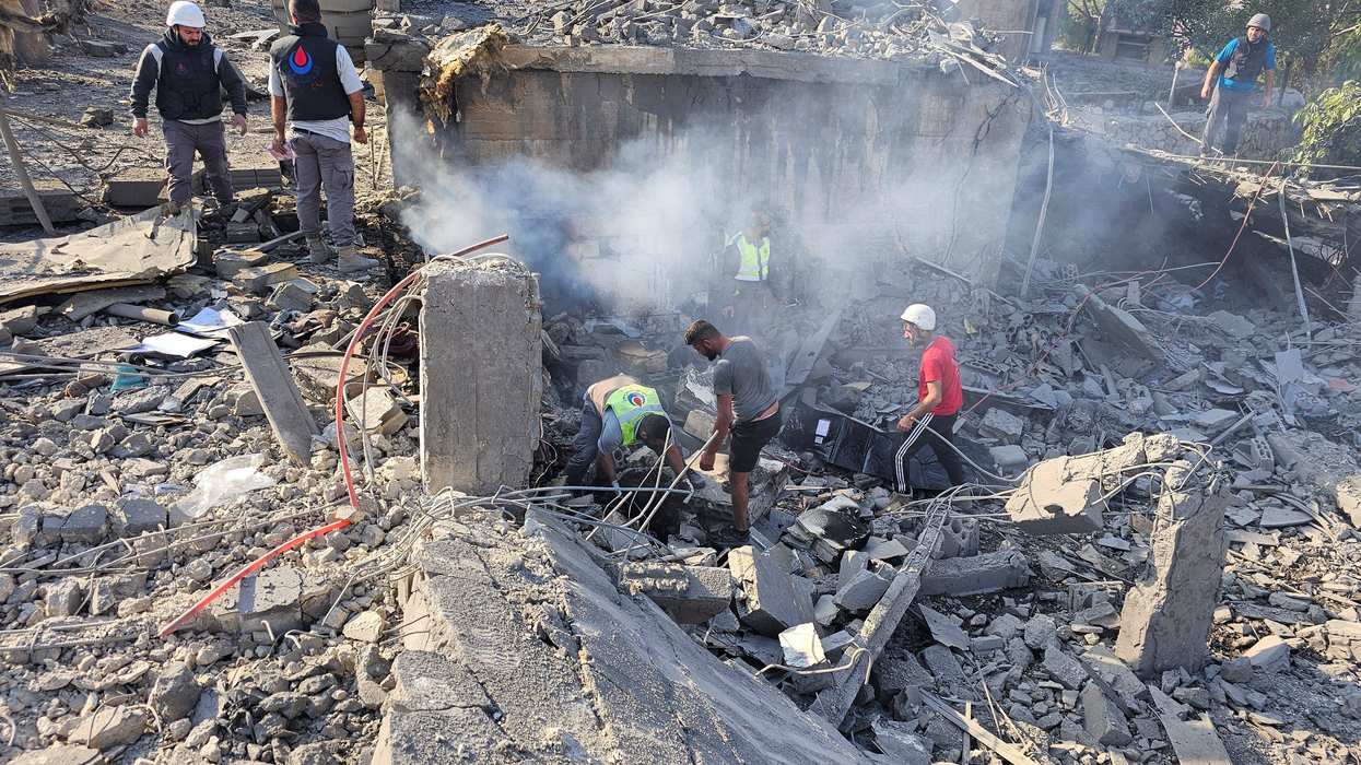 Rescuers work at a site damaged in the aftermath of an Israeli strike in Sohmor, in Lebanon's Bekaa Valley, October 30, 2024.