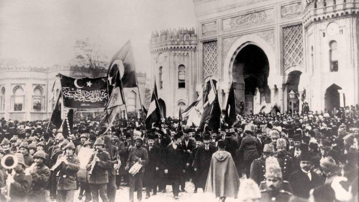 Residents of Constantinople (today: Istanbul, Turkey) celebrate the entry into World War I of the Ottoman Empire in front of the Ministry of War