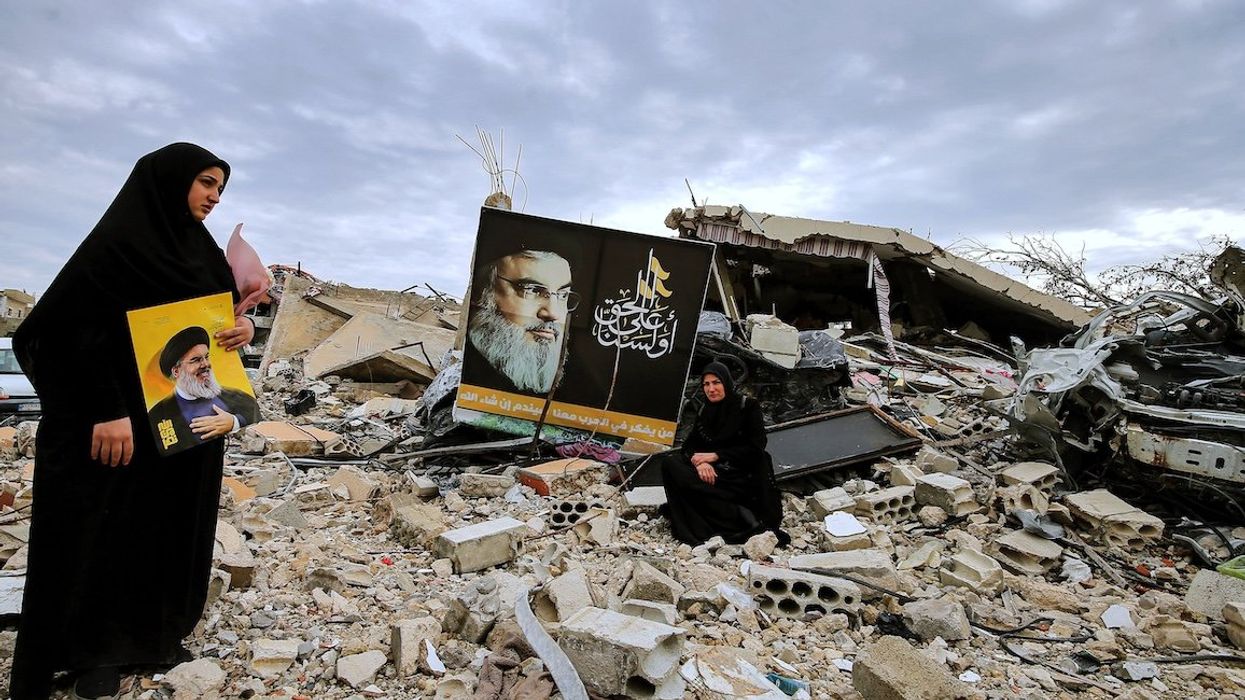 Residents of south Lebanon, who were displaced during the war, tried to return to their villages still occupied by Israel despite the expiration of the 60-day ceasefire implementation period. These Lebanese Muslim Shiite women inspect their destroyed house in the southern Lebanese border village of Ayta ash-Shaab after returning to their devastated hamlet.