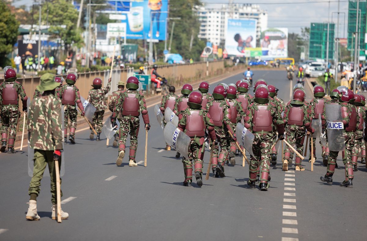 Riot police disperse supporters of Kenyan opposition leader Raila Odinga in Nairobi. 