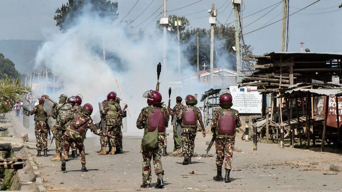 Riot police officers fire tear gas canisters to disperse demonstrators in the Rift Valley town of Nakuru, Kenya, on July 7, 2025.
