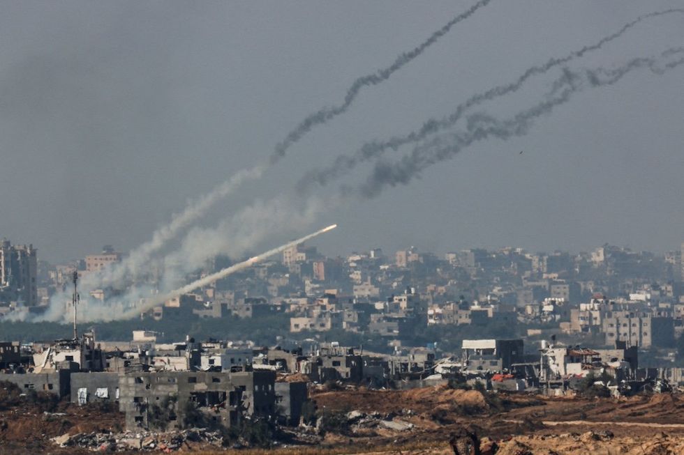 Rockets are launched from the Gaza Strip into Israel, after a temporary truce between Israel and the Palestinian Islamist group Hamas expired, as seen from Israel's border with Gaza in southern Israel, December 1, 2023