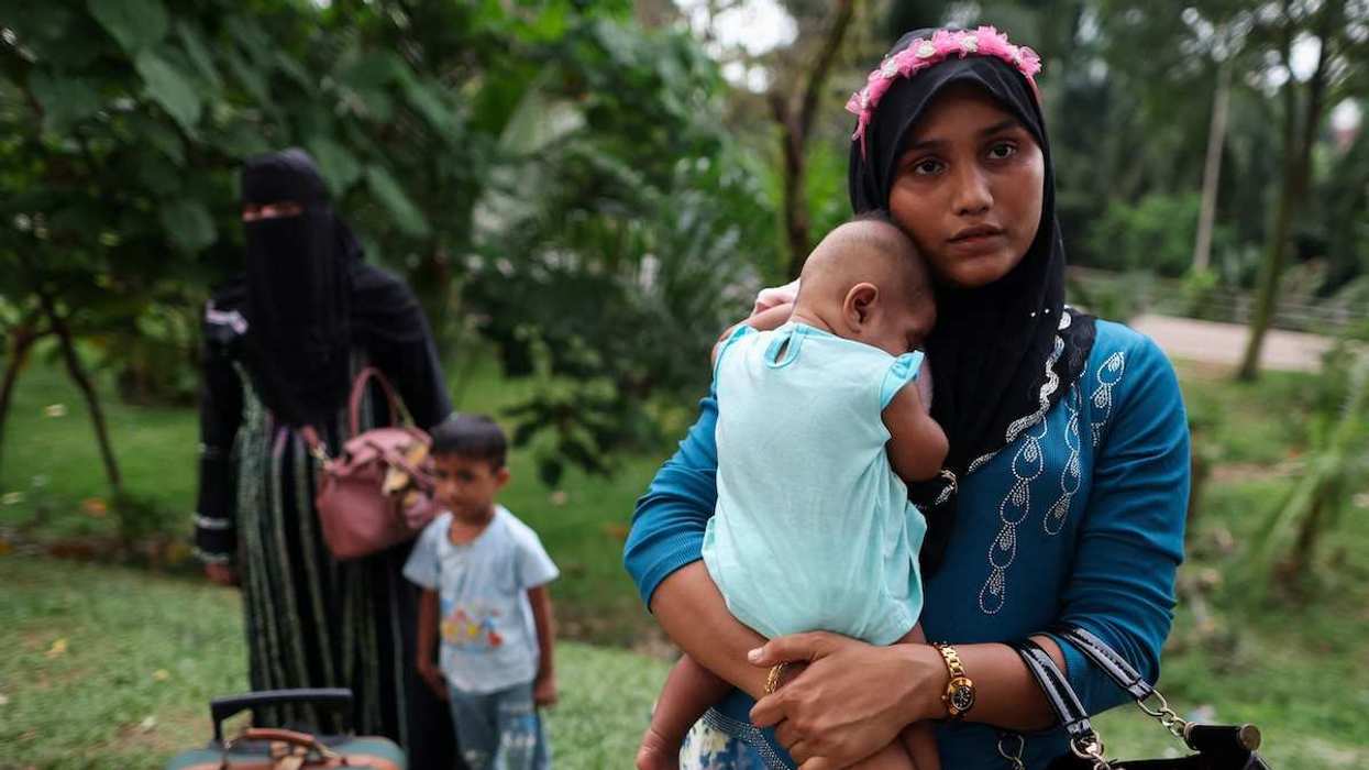 Rohingya refugees gather in front of the office of the U.N. refugee agency after being evicted from their homes, at Kuala Lumpur Malaysia.