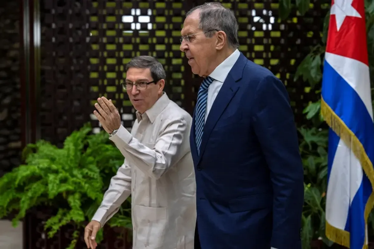 Russia's Foreign Minister Sergei Lavrov walks with Cuba's Foreign Minister Bruno Rodriguez during a meeting in Havana, Cuba, April 20, 2023