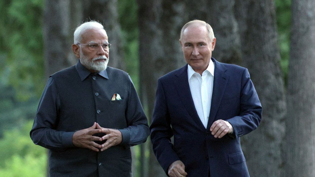 Russia's President Vladimir Putin and India's Prime Minister Narendra Modi walk during their meeting at the Novo-Ogaryovo state residence near Moscow, Russia July 8, 2024.