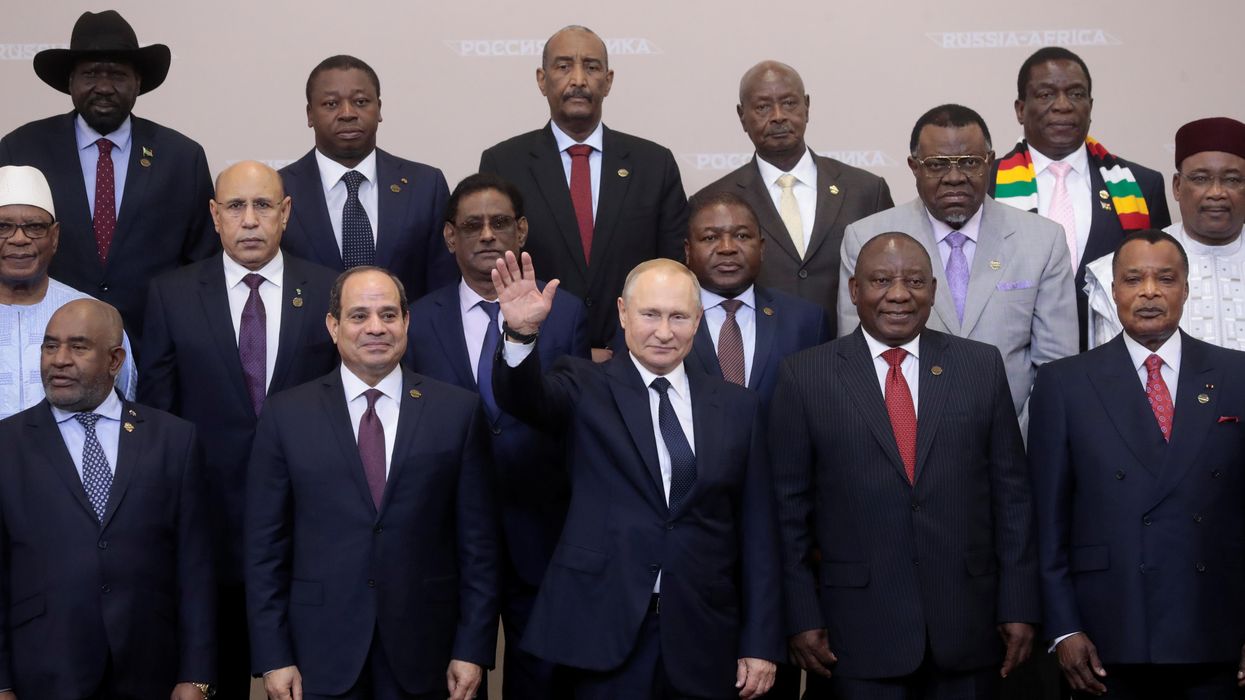 Russia's President Vladimir Putin waves during a family photo with heads of countries taking part in the 2019 Russia-Africa Summit at the Sirius Park of Science and Art in Sochi, Russia, October 24, 2019.