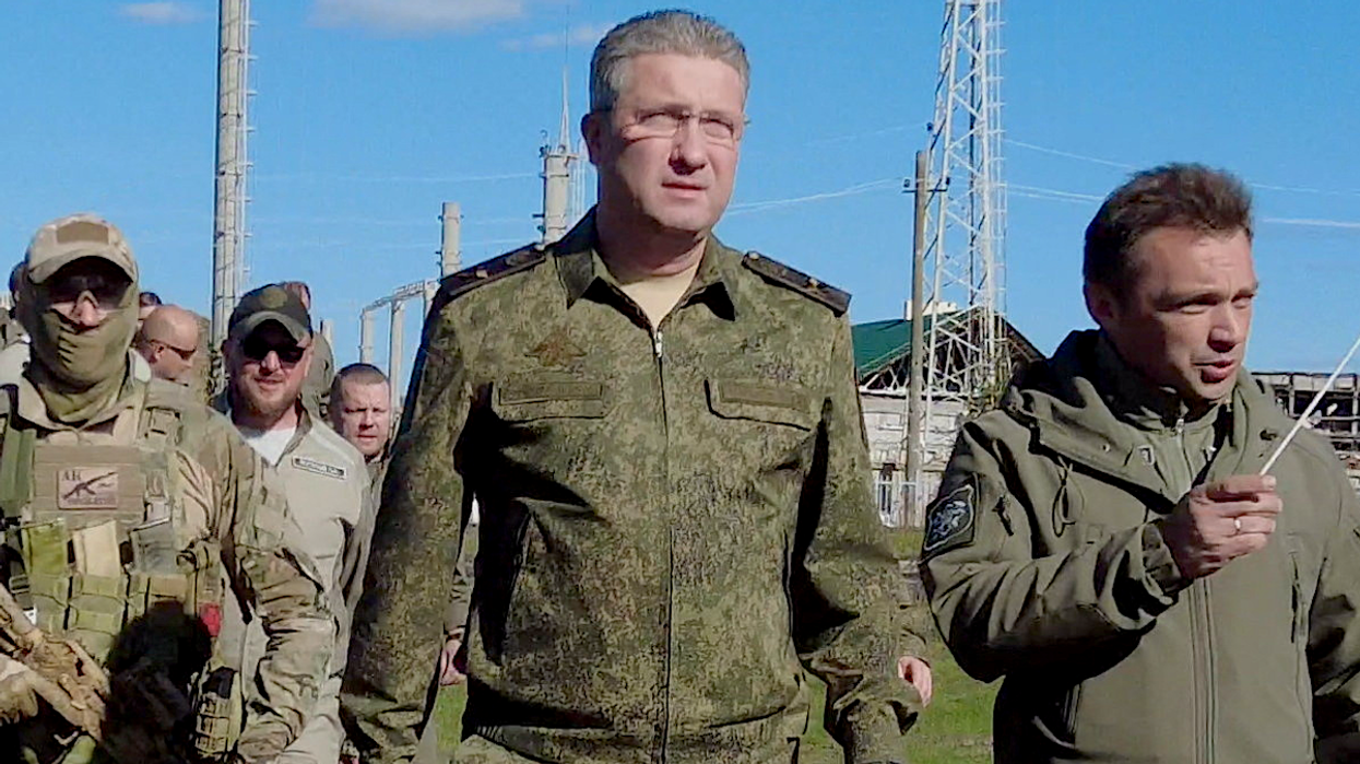 Russian Deputy Defence Minister Timur Ivanov inspects the construction of apartment blocks in Mariupol, Russian-controlled Ukraine, in this October 2022 image.