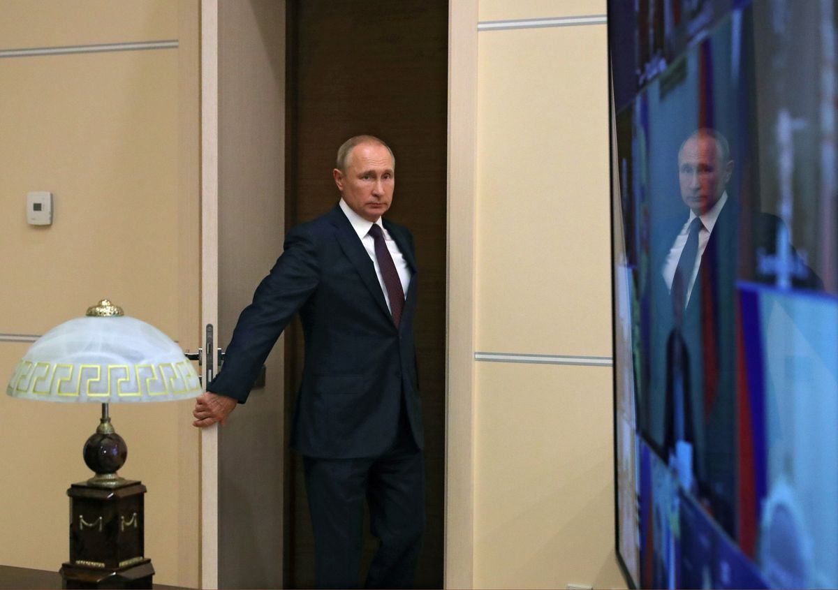 Russian President Vladimir Putin arrives for a meeting with members of the Security Council via a video link at the Novo-Ogaryovo state residence outside Moscow, Russia September 4, 2020. 