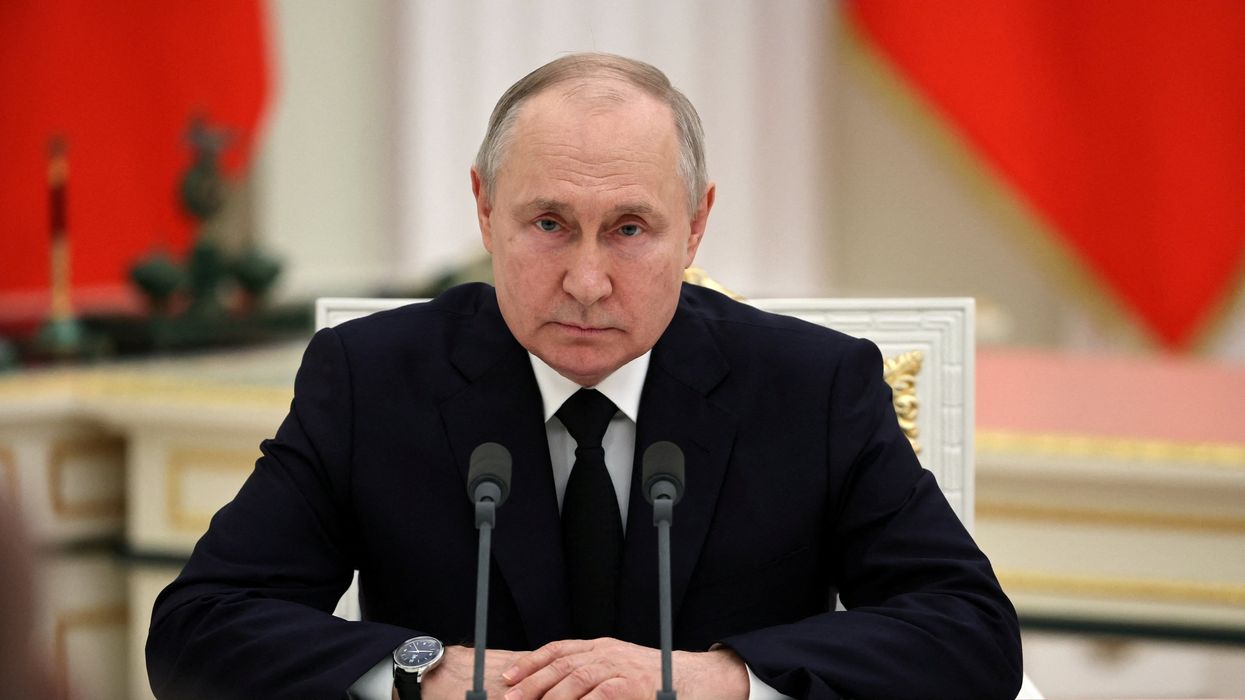 Russian President Vladimir Putin attends a televised meeting in Russia