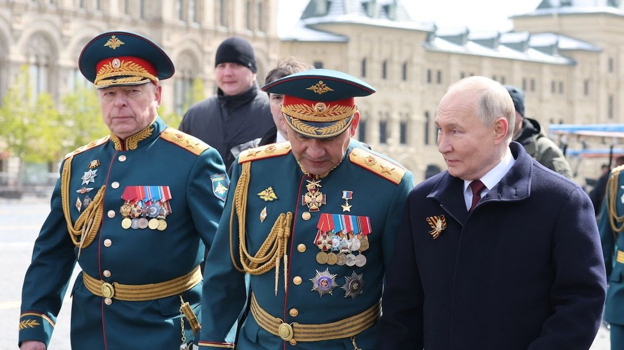 Russian President Vladimir Putin, Defence Minister Sergei Shoigu, and Chief of the Russian Land Forces Oleg Salyukov attend a military parade on Victory Day, in Moscow, on May 9, 2024.
