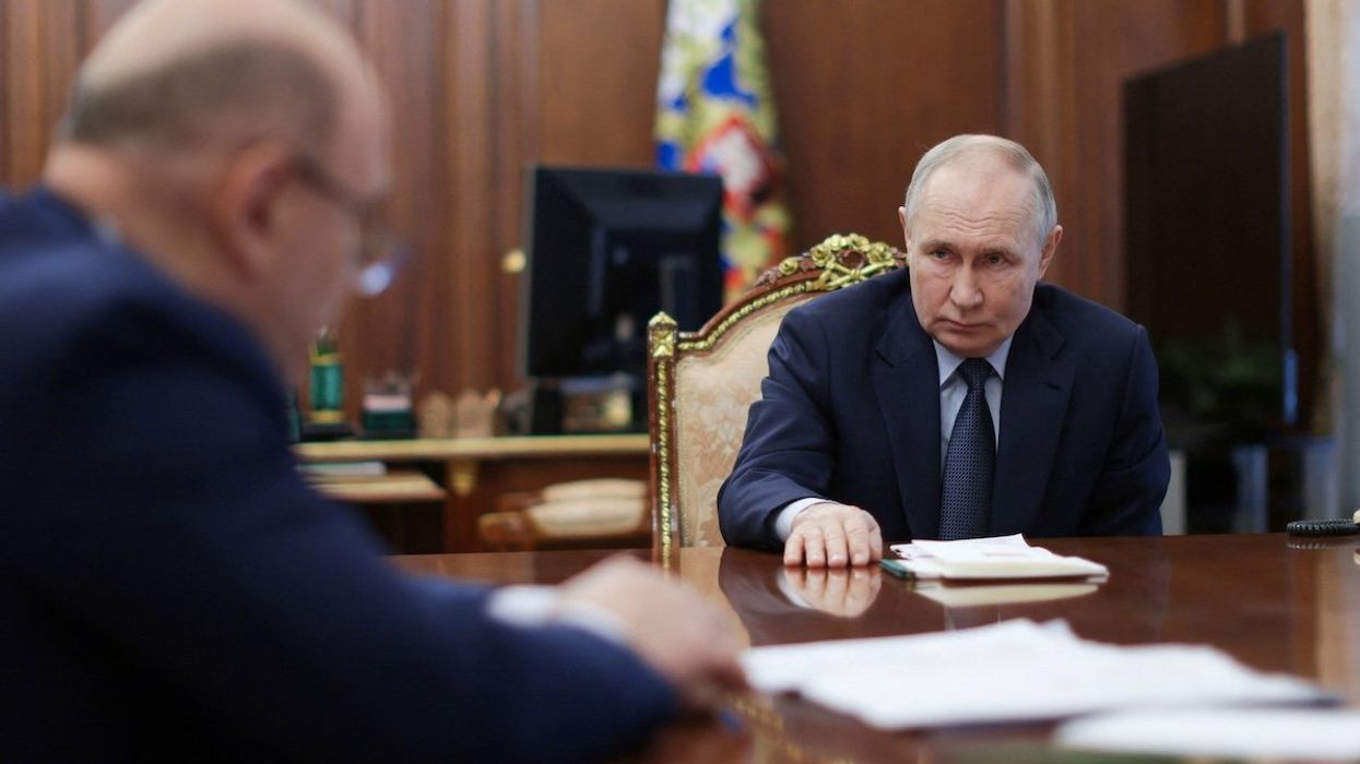 Russian President Vladimir Putin meets with Prime Minister Mikhail Mishustin at the Kremlin in Moscow, Russia, on Feb. 7, 2025.