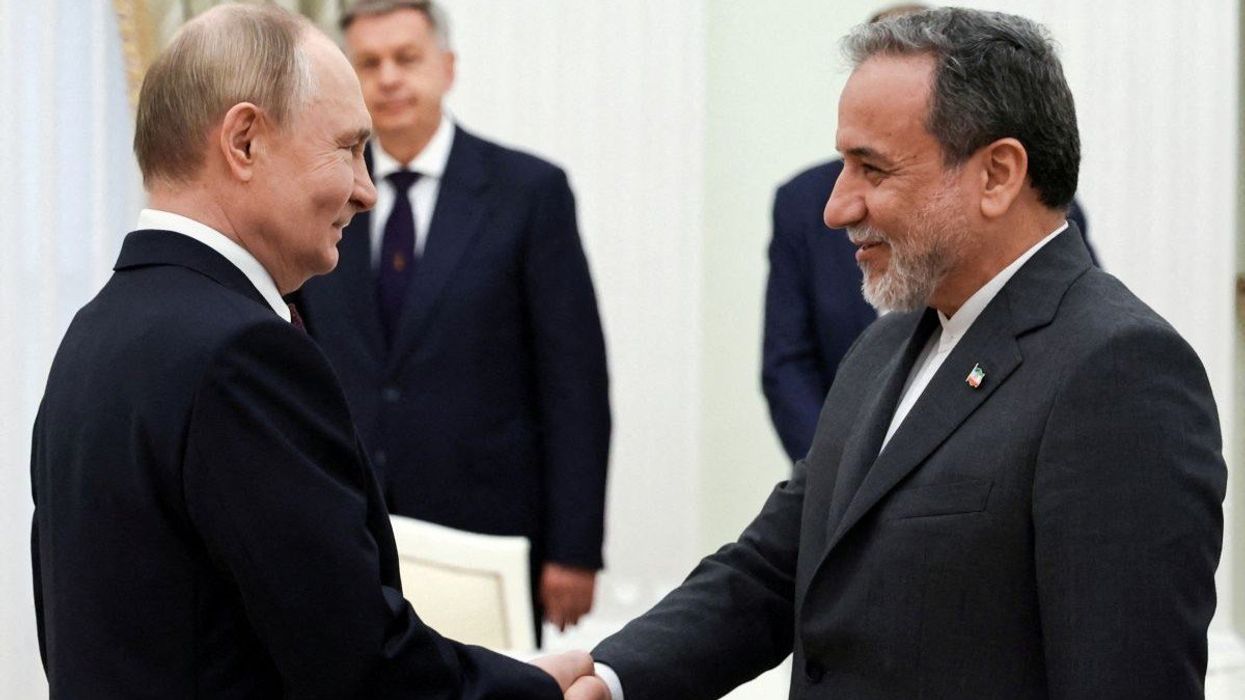 Russian President Vladimir Putin shakes hands with Iranian Foreign Minister Abbas Araghchi in Moscow, Russia, on June 23, 2025.