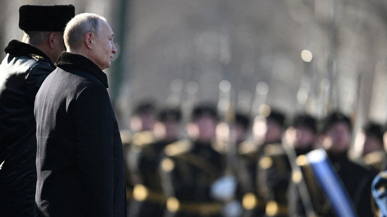 Russian President Vladimir Putin takes part in a wreath-laying ceremony at the Tomb of the Unknown Soldier by the Kremlin Wall on the Defender of the Fatherland Day in Moscow, Russia, Feb. 23, 2023.