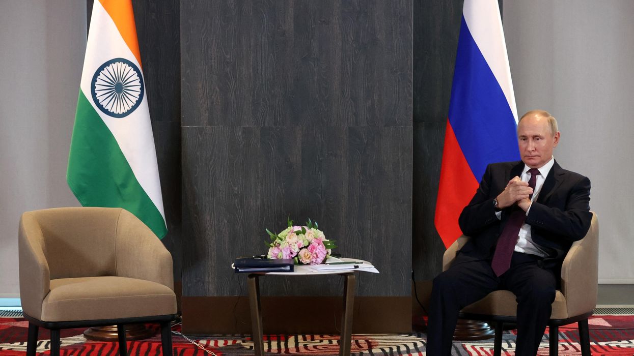 Russian President Vladimir Putin waits to meet India's PM Narendra Modi on the sidelines of the SCO summit in Samarkand, Uzbekistan.