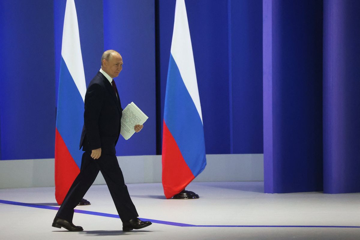 Russian President Vladimir Putin walks to deliver his annual address to the Federal Assembly in Moscow. 