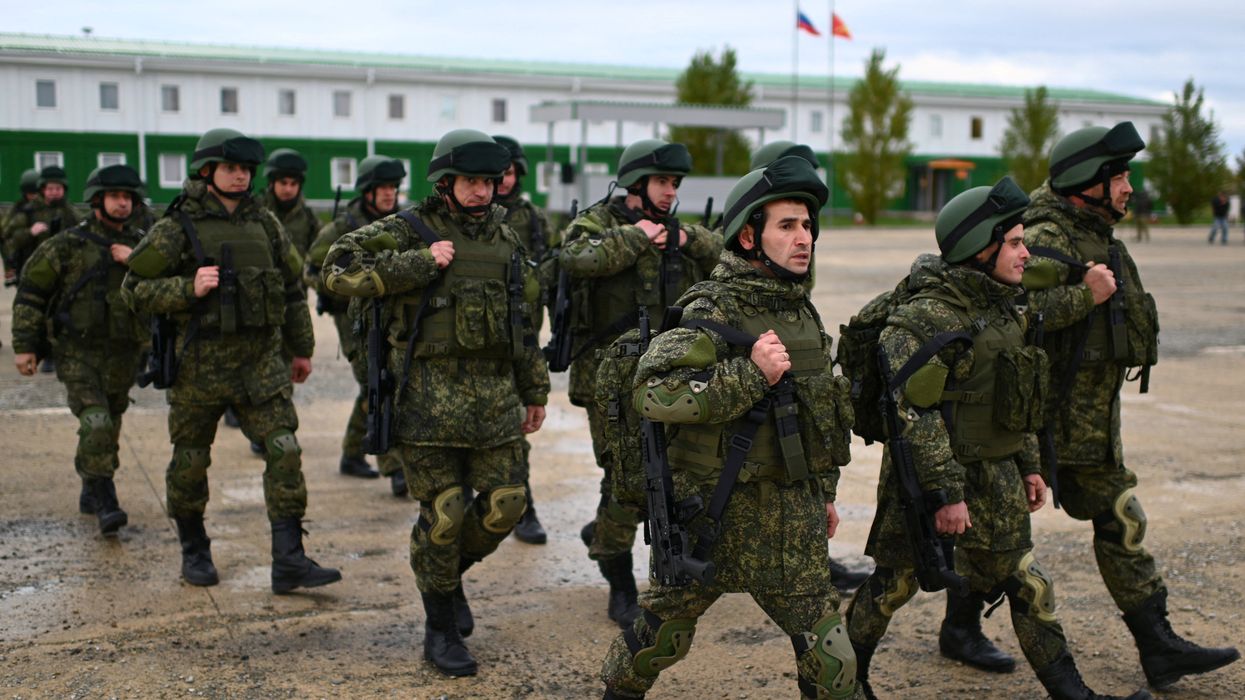 Russian reservists recruited during a partial mobilisation of troops attend a ceremony before departing to the Russia-Ukraine conflict zone, in the Rostov region, Russia October 31, 2022.