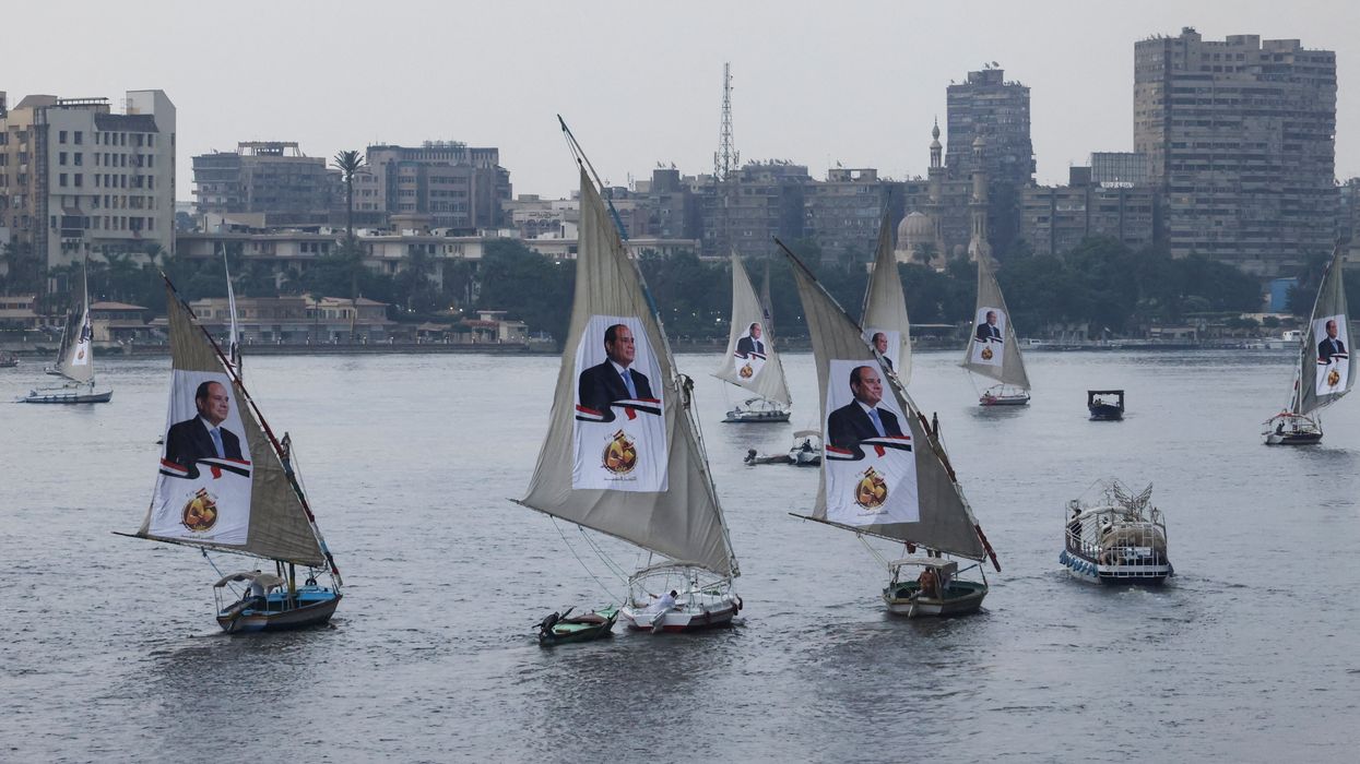 Sailboats bearing posters of Egyptian President Abdel Fattah al-Sisi take part in a rally on the River Nile to back his candidacy in the presidential elections in December, in Cairo, Egypt, October 2, 2023.