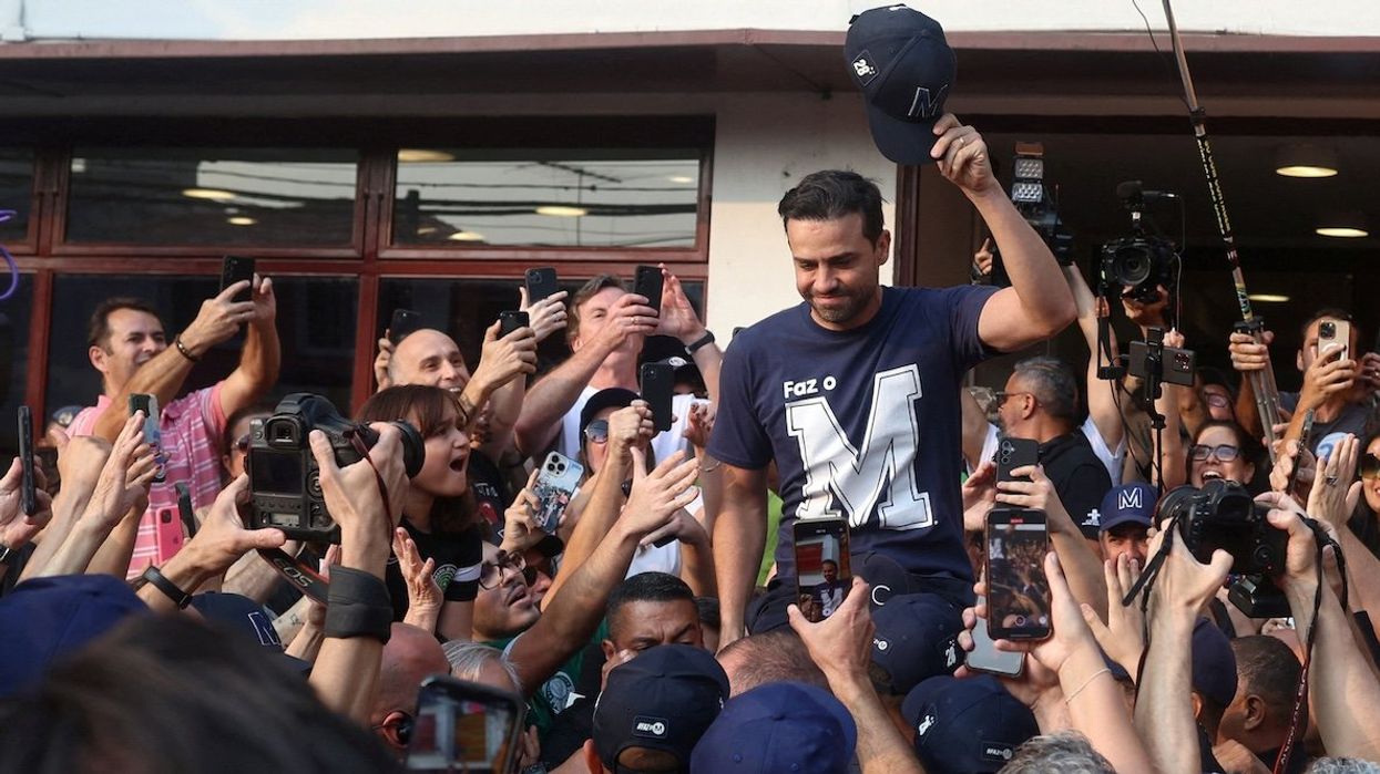 Sao Paulo far-right digital influencer and mayor candidate Pablo Marcal leaves a polling station on supporters' shoulders after voting at a polling station during the municipal elections in Sao Paulo, Brazil, on Oct. 6, 2024.
