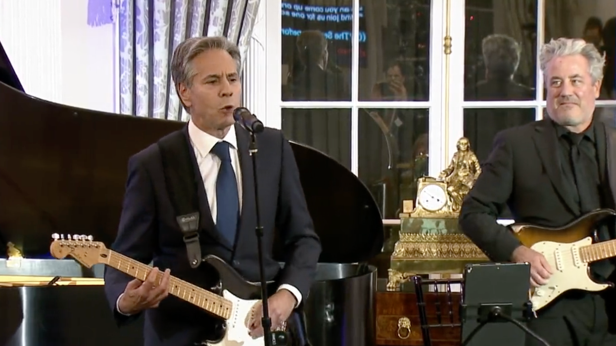 Secretary of State Antony Blinken plays guitar at the State Department, September 27, 2023.