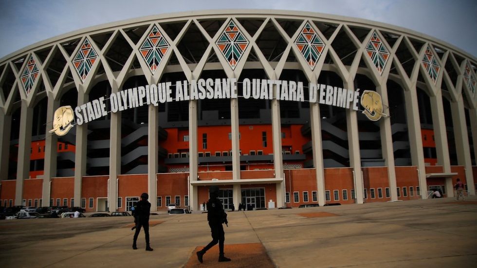 Security forces officers stand guard in front of the Alassane Ouattara Olympic Stadium of Ebimpe in Abidjan, Ivory Coast, on July 11, 2023