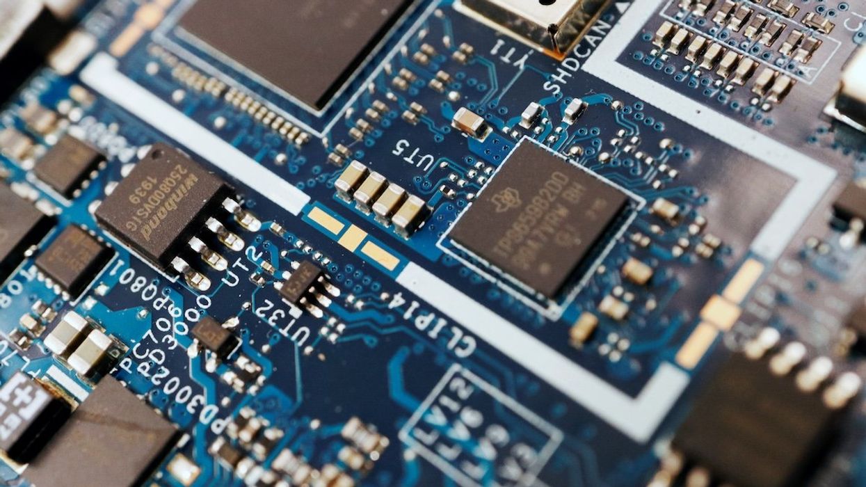 Semiconductor chips are seen on a circuit board of a computer in this illustration.
