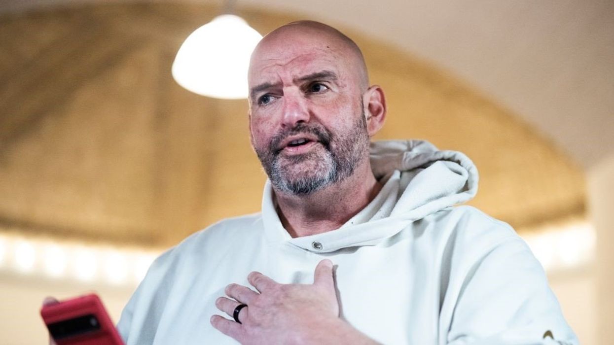 Sen. John Fetterman, D-Pa., talks with reporters in Russell building after a senate vote on Wednesday, February 19, 2025.