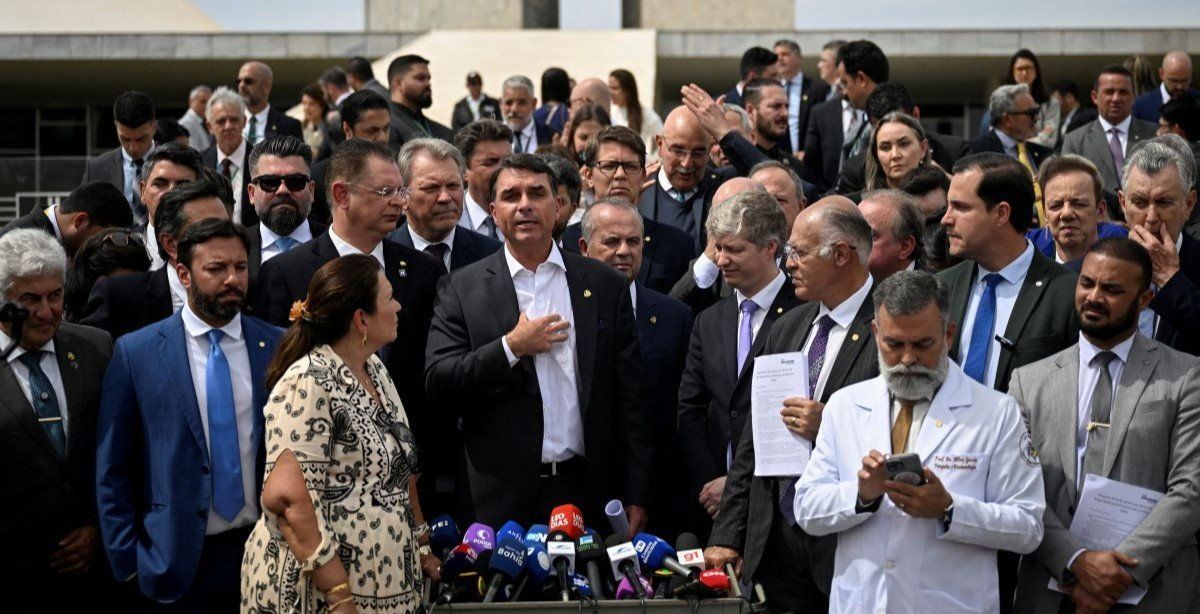 ​Senator Flavio Bolsonaro, son of former Brazilian President Jair Bolsonaro, speaks during a press conference, after Brazil's Supreme Court issued a house arrest order for his father, in Brasilia, Brazil, August 5, 2025. 