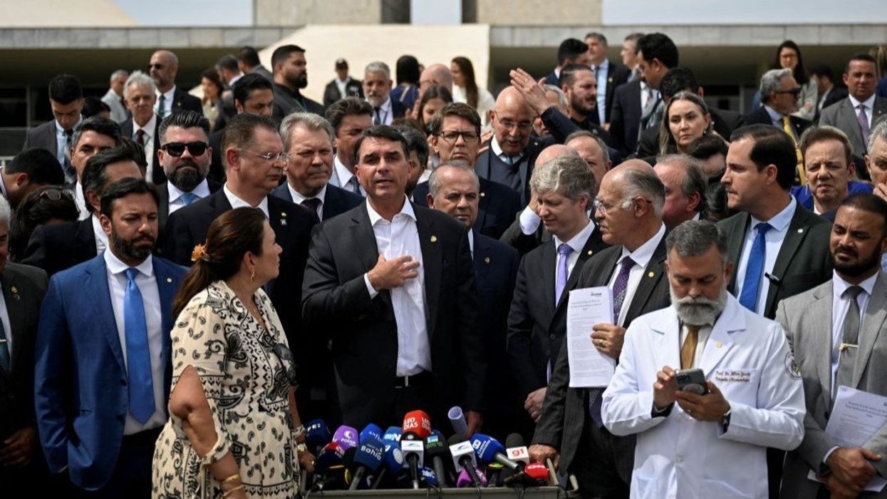 Senator Flavio Bolsonaro, son of former Brazilian President Jair Bolsonaro, speaks during a press conference, after Brazil's Supreme Court issued a house arrest order for his father, in Brasilia, Brazil, August 5, 2025.