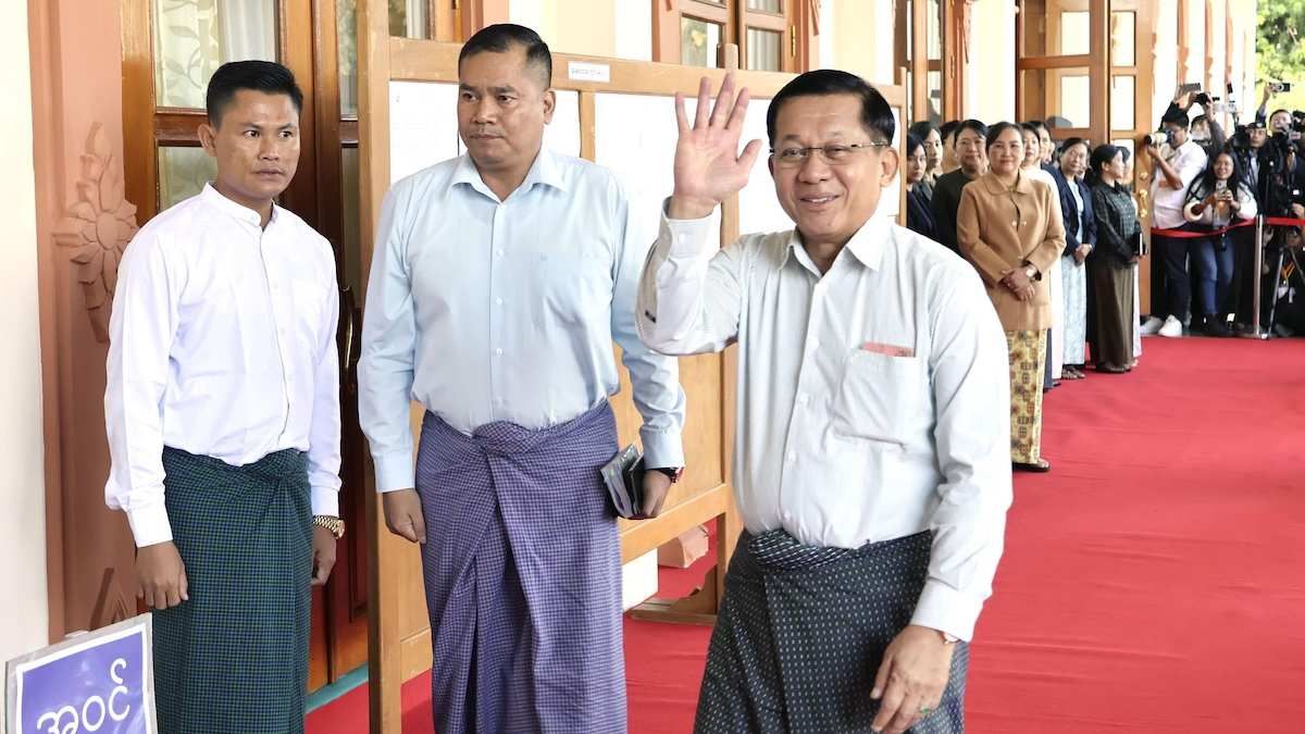 Senior Gen. Min Aung Hlaing (R) arrives at a polling station in the Myanmar capital of Naypyitaw on Dec. 28, 2025.
