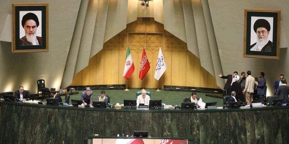 ​September 28, 2025, Tehran, Iran: Iranian lawmakers participate in an open session of parliament. Iran has recalled its envoys to Britain, France, and Germany for consultations after the three countries.