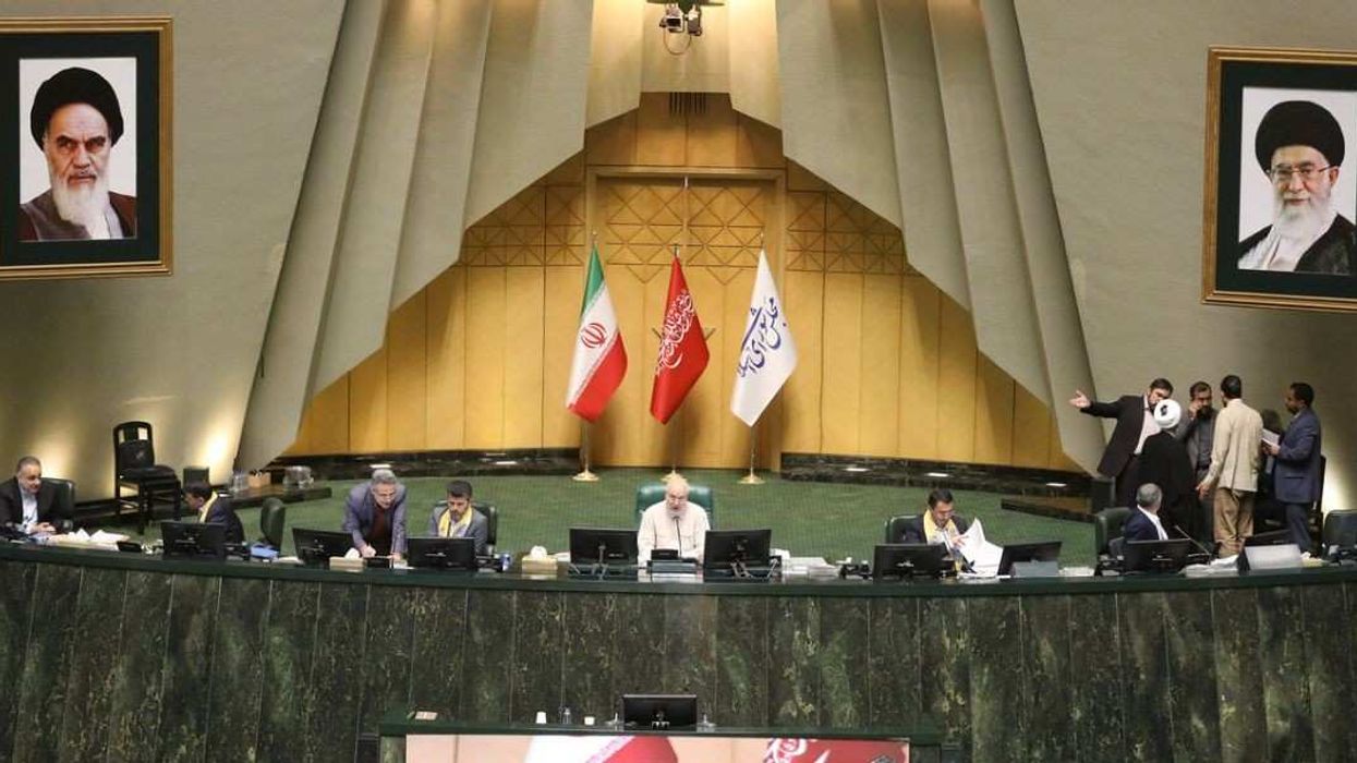 September 28, 2025, Tehran, Iran: Iranian lawmakers participate in an open session of parliament. Iran has recalled its envoys to Britain, France, and Germany for consultations after the three countries.