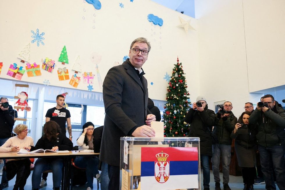 Serbian President Aleksandar Vucic casts his vote at a polling station during the parliamentary election in Belgrade, Serbia, December 17, 2023.