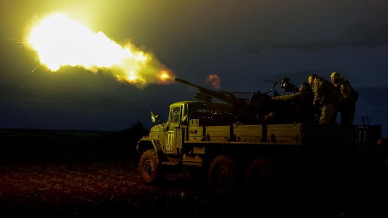 Servicemen from the mobile air defence unit of the 115th Separate Mechanized Brigade of the Ukrainian Armed Forces fire a ZU-23-2 anti-aircraft cannon towards a Russian drone during an overnight shift, amid Russia's attack on Ukraine, in Kharkiv Region, Ukraine June 2, 2025.