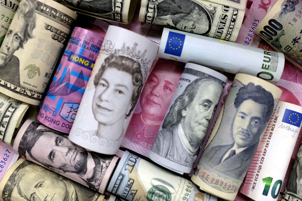 several currencies from different countries rolled up.