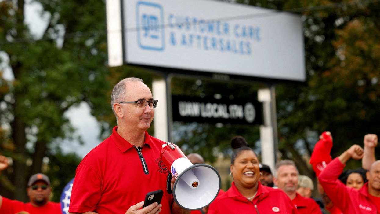 Shawn Fain, president of the United Auto Workers (UAW) speaks as President Joe Biden joins striking UAW members on the picket line in Belleville, Mich., in September.
