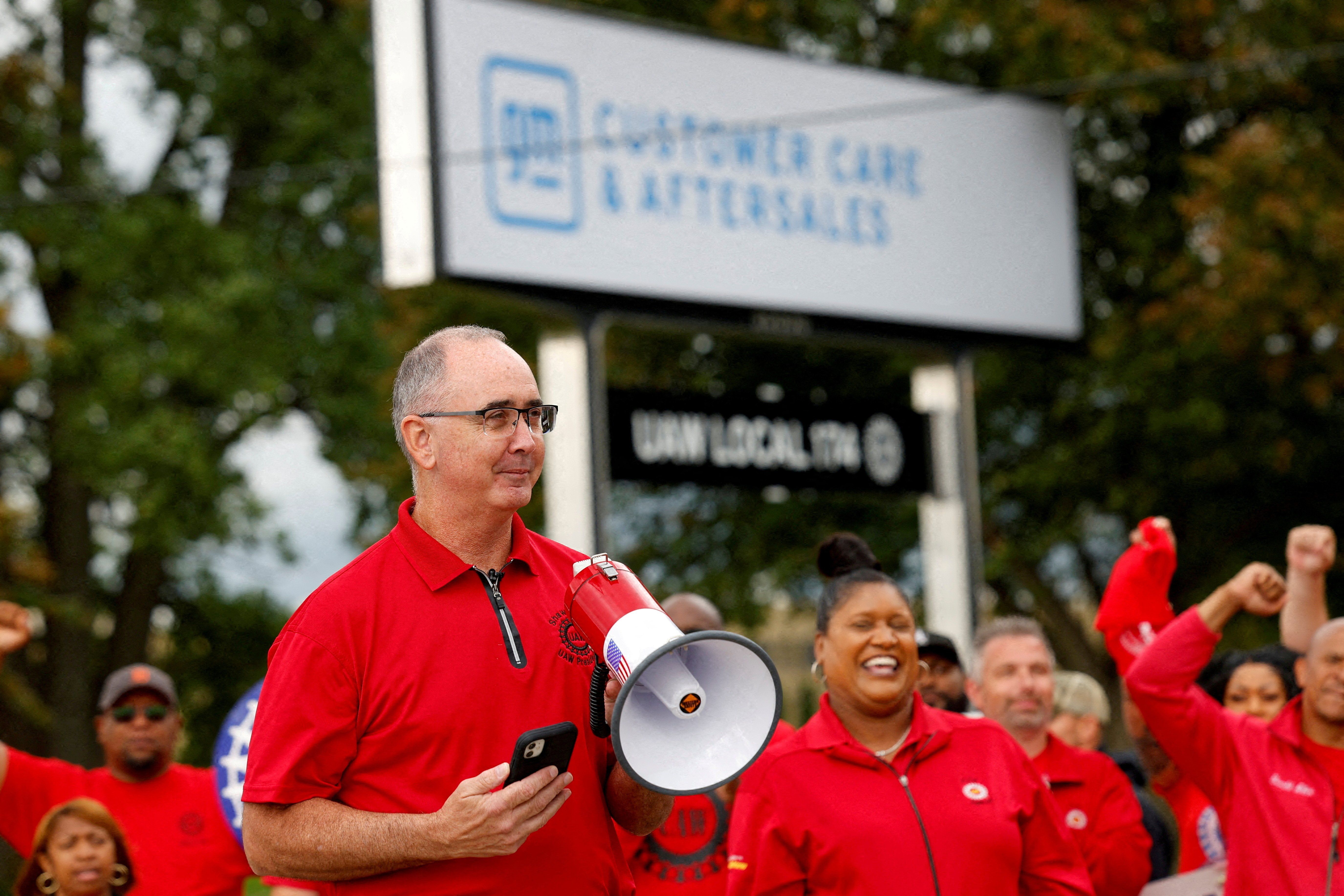 Shawn Fain, president of the United Auto Workers (UAW) speaks as President Joe Biden joins striking UAW members on the picket line in Belleville, Mich., in September.