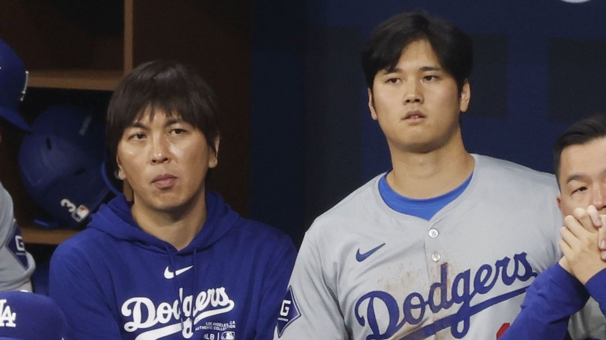 Shohei Ohtani of the Los Angeles Dodgers and his interpreter Ippei Mizuhara watch Major League Baseball's season-opening game against the San Diego Padres at Seoul's Gocheok Sky Dome on March 20, 2024